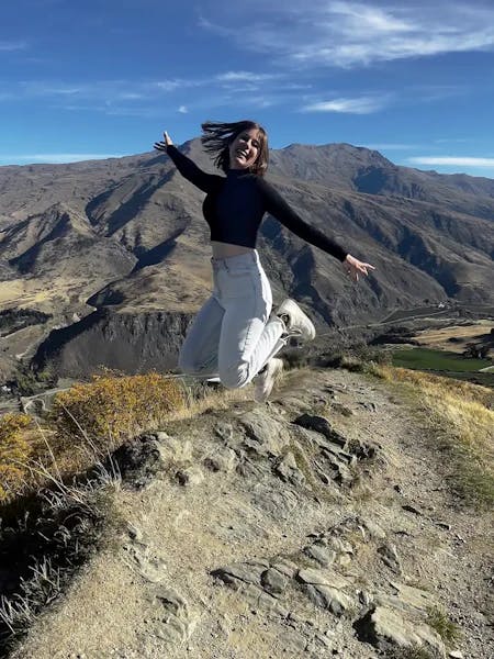 student jumping in New Zealand