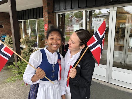 students holding Norway flags